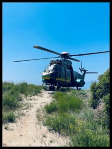 LASD Air 5 'Super Puma' helicopter on a mountaintop in Los Angeles County