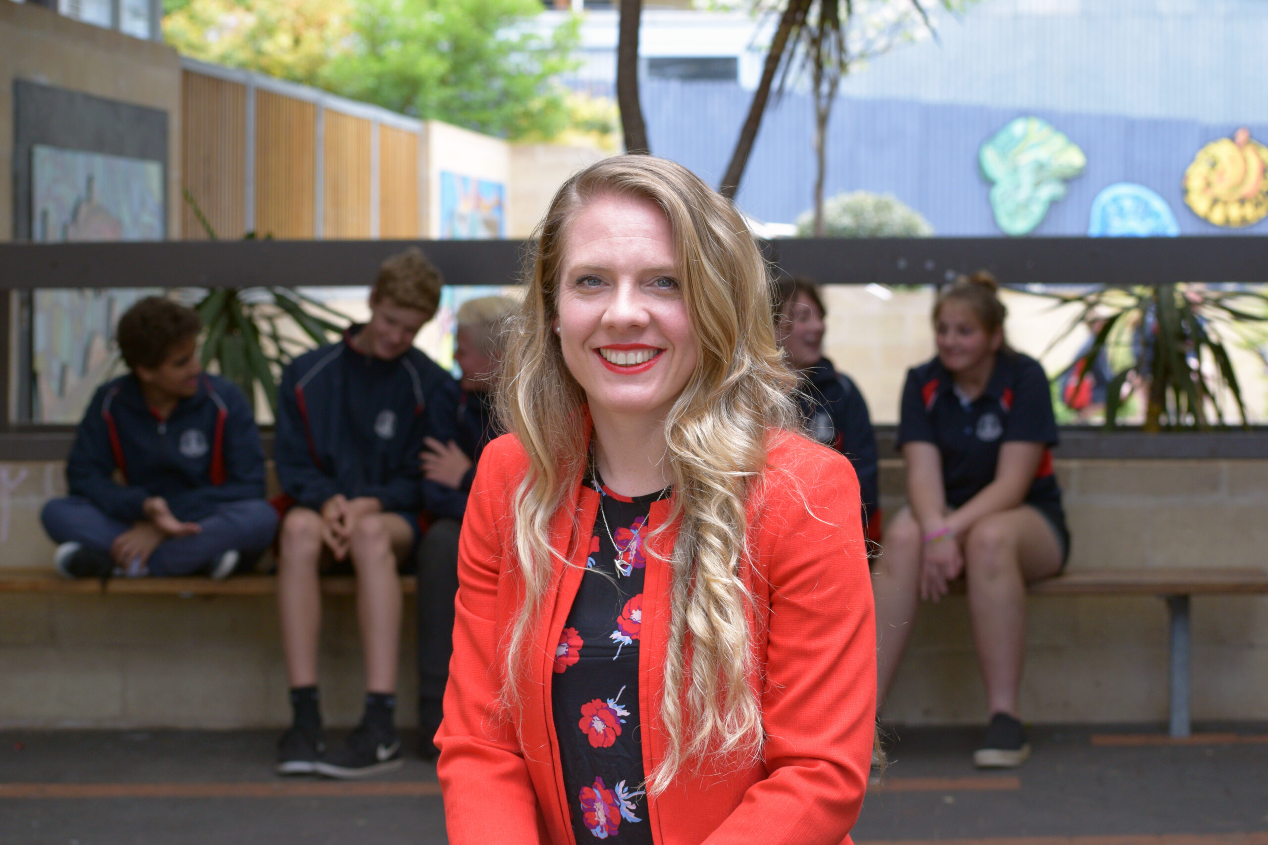 A woman smiles at the camera featured image